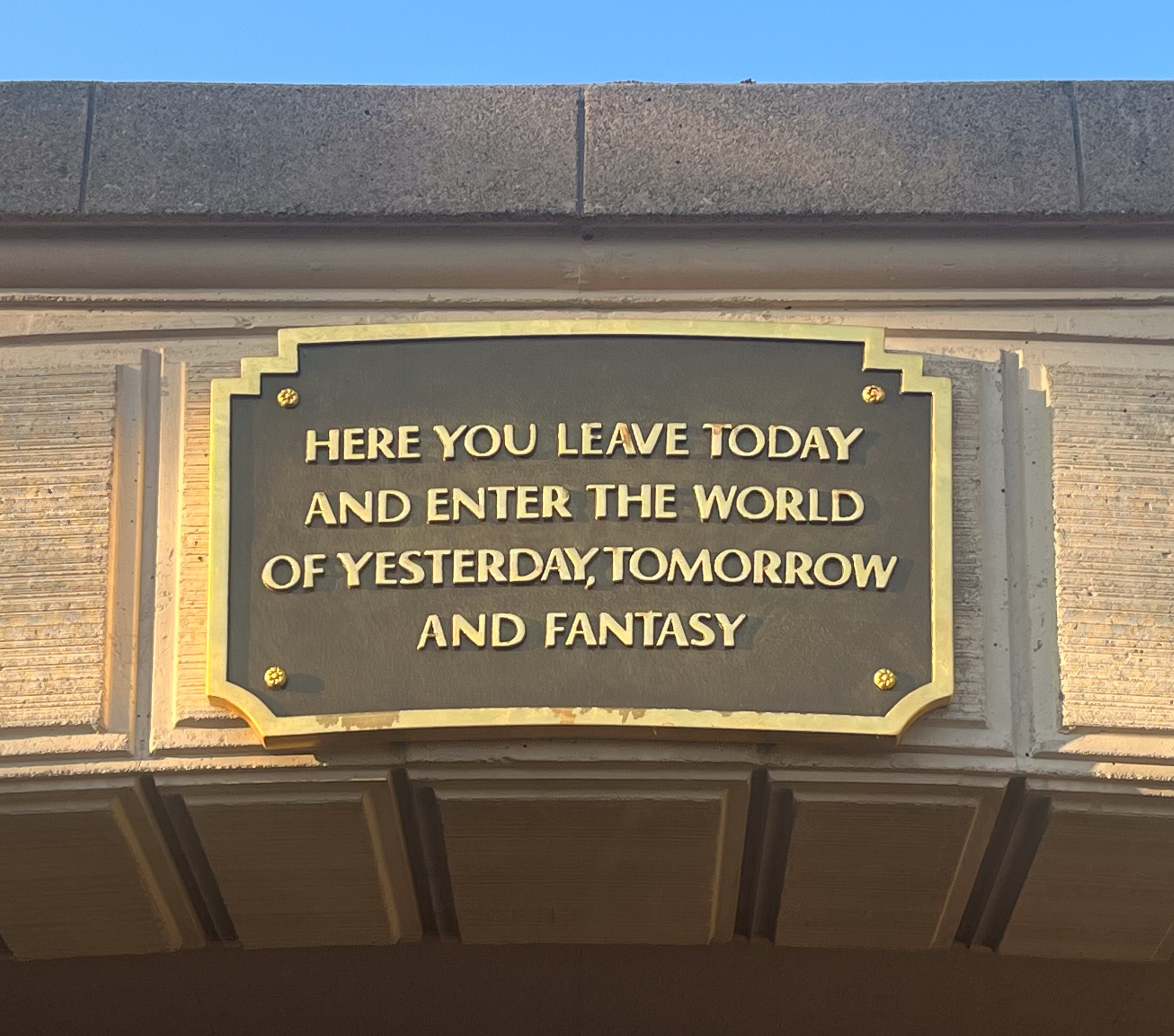 welcome sign at Disneyland Tunnel reads Here you leave today and enter the world of yesterday, tomorrow and fantasy